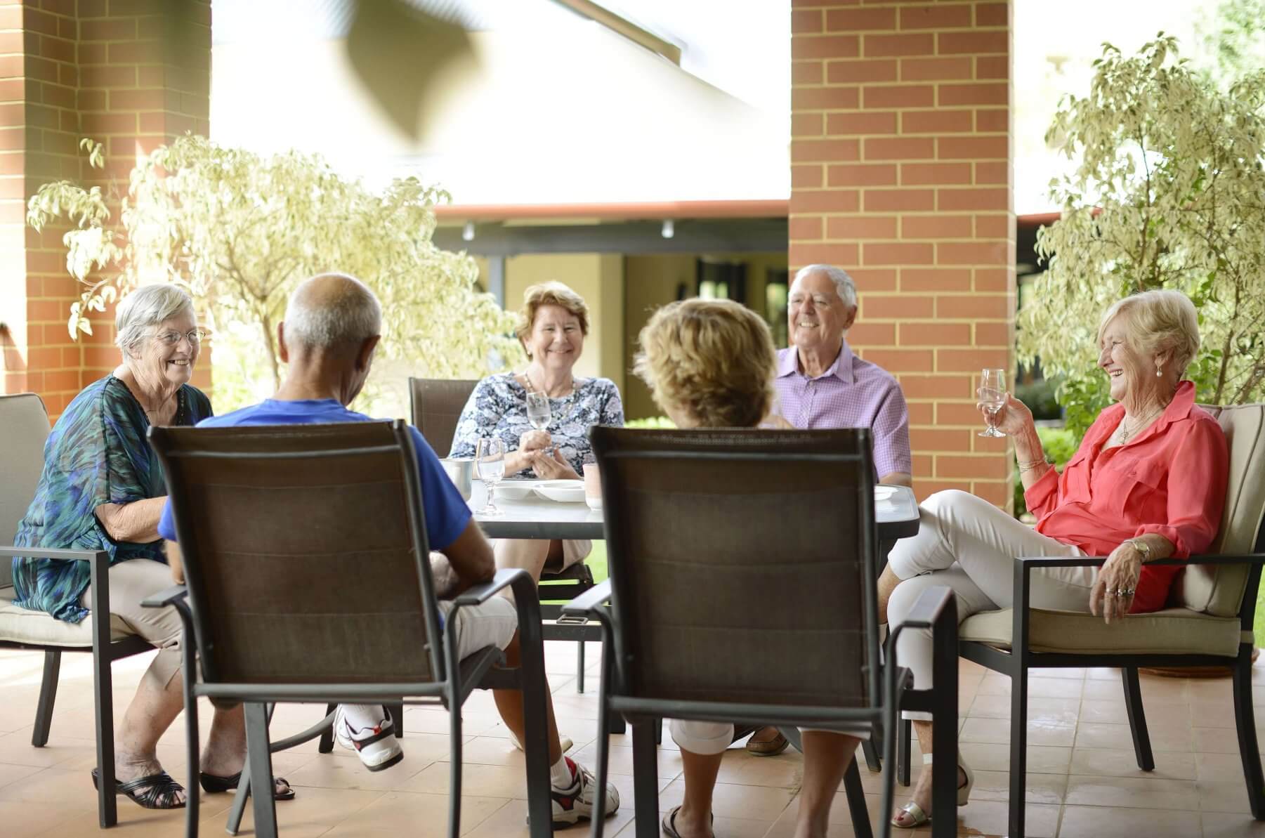 Residents socialising on a verandah at St Ives Centro retirement village